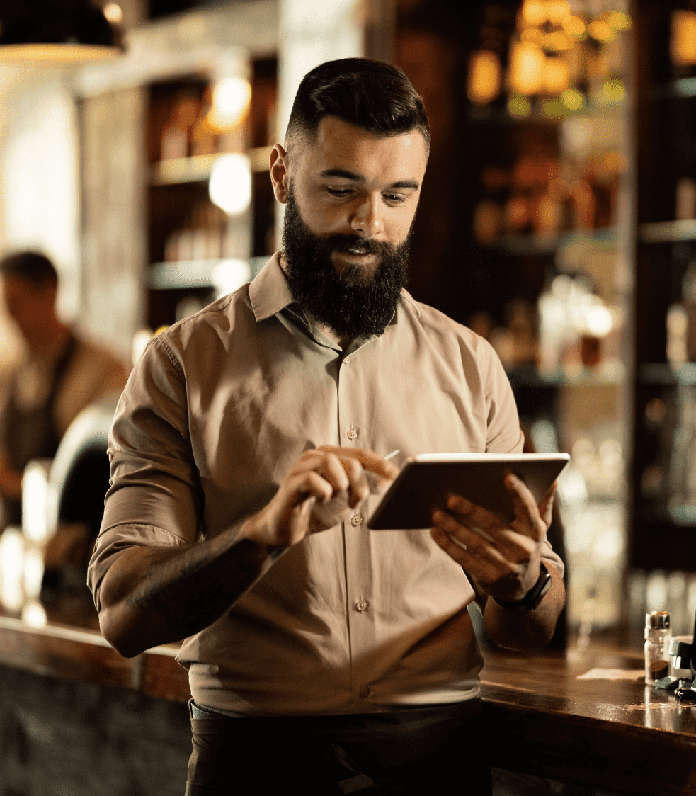 Person using a tablet in a bar